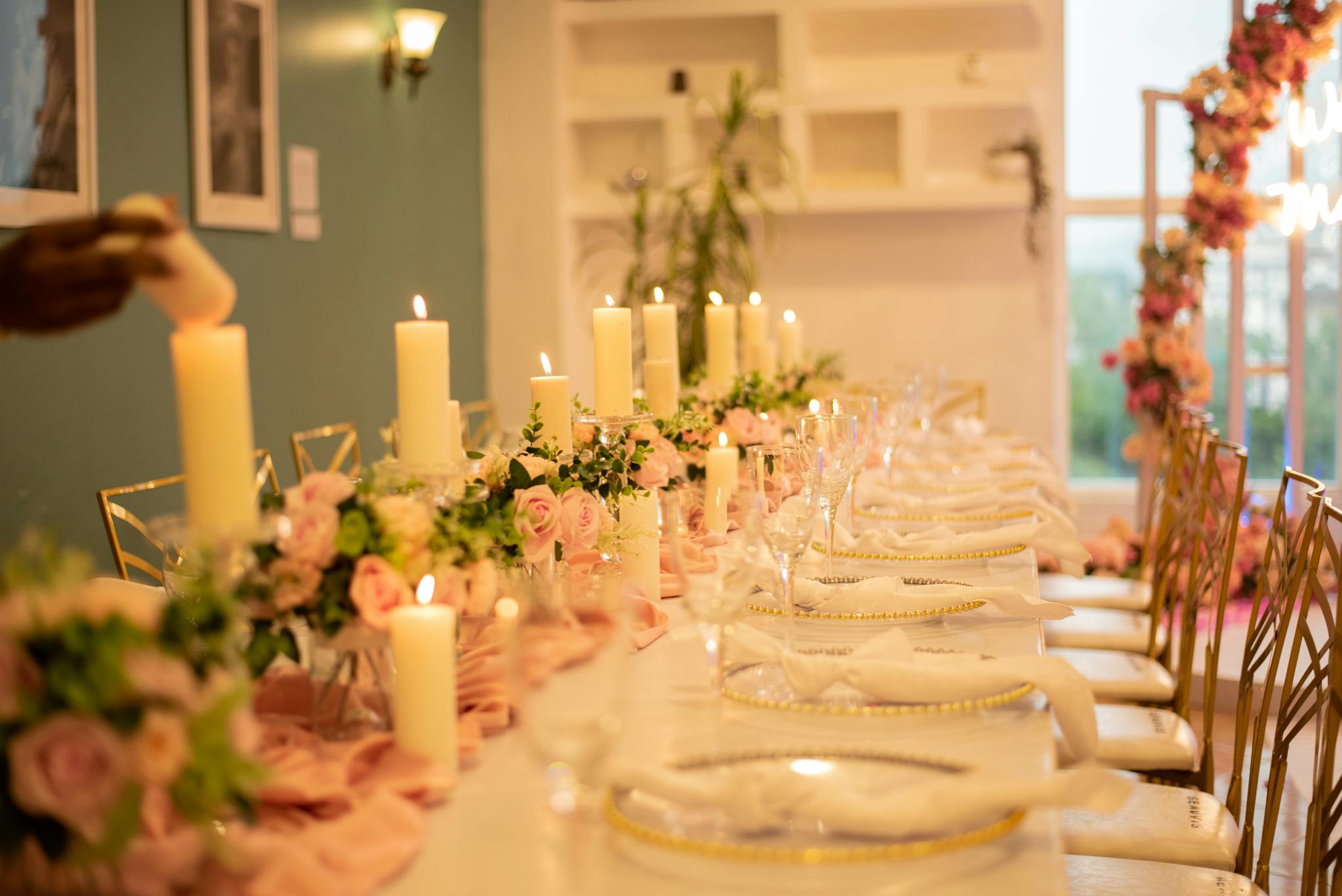 Beautifully arranged candlelit wedding table with floral decor, creating a romantic atmosphere in Lagos, Nigeria.